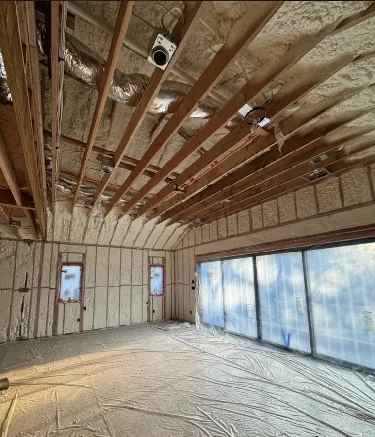 Interior walls and ceiling insulated with spray foam during new construction in Gulf Park Estates
